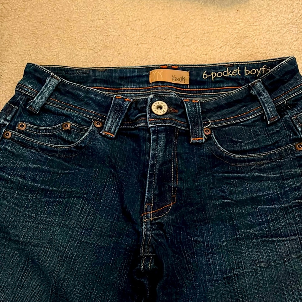 Dark wash bootcut boyfriend style jeans.